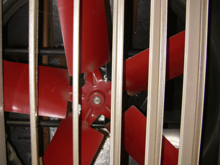 Figure showing an open barometric damper with a fan above. Figure showing an open barometric damper with a fan above.